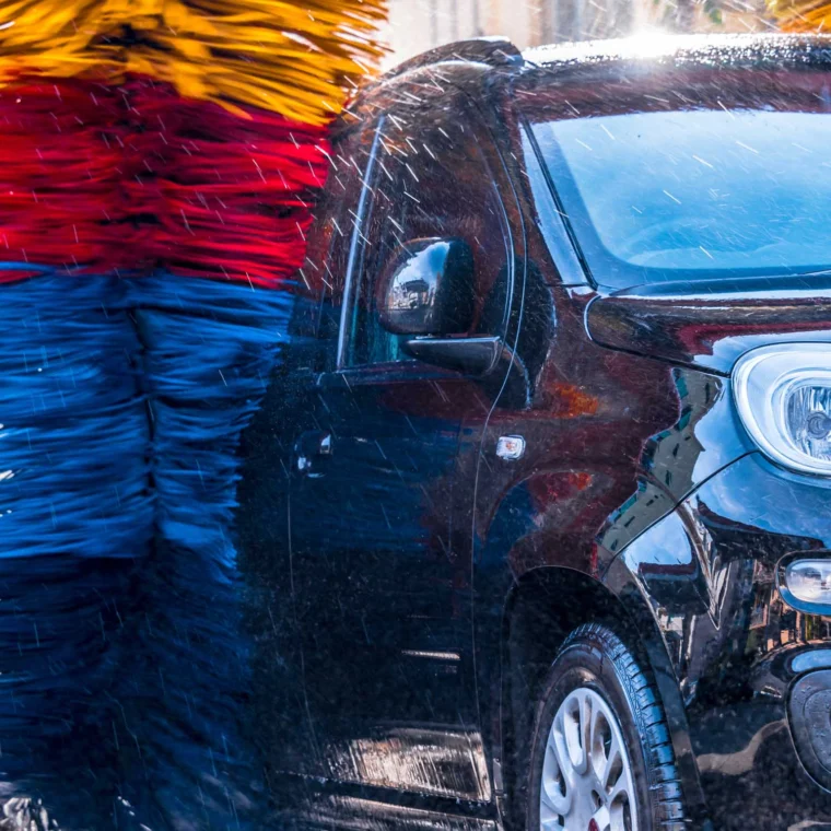 Car going through an automated car wash machine