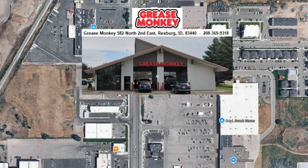 Aerial view of Grease Monkey car maintenance location at 582 North 2nd East, Rexburg, Idaho, featuring oil changes, with business photo and contact information overlaid.