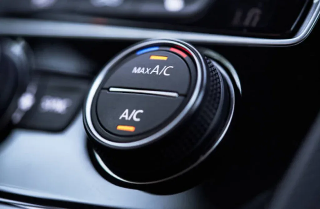 Close-up of a car's air conditioning control dial showing temperature settings and a max A/C option, perfect for staying cool in Pocatello. Trust Grease Monkey for expert Car AC service and reliable comfort on the road.