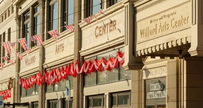 The exterior of the Willard Arts Center building in Idaho Falls, decorated with red and white bunting and a sign reading "Coming Attraction" in one window, catches the eye of every passing vehicle.
