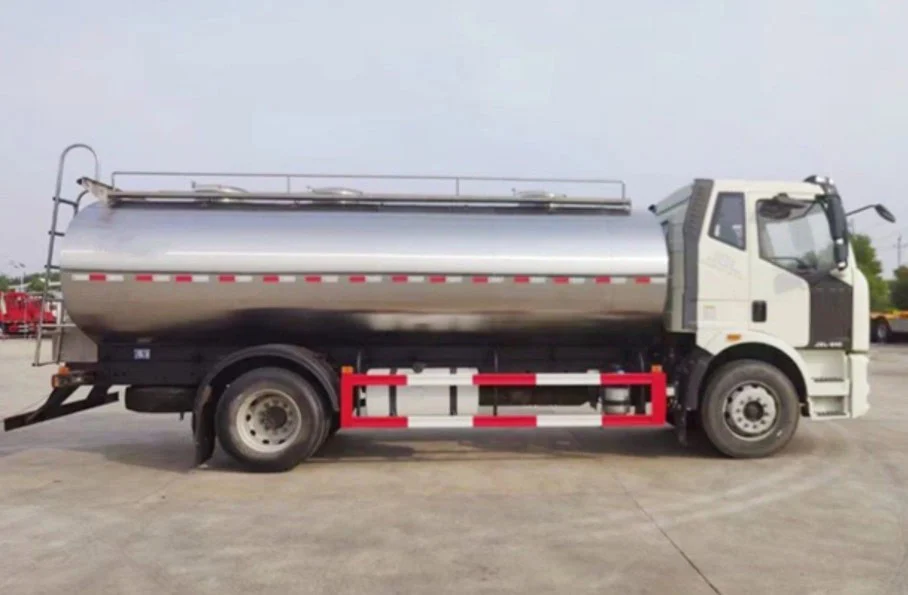 A white and silver tanker truck, recently inspected for vehicle service, is parked on a paved surface in an outdoor setting during the day in Jerome, Idaho.