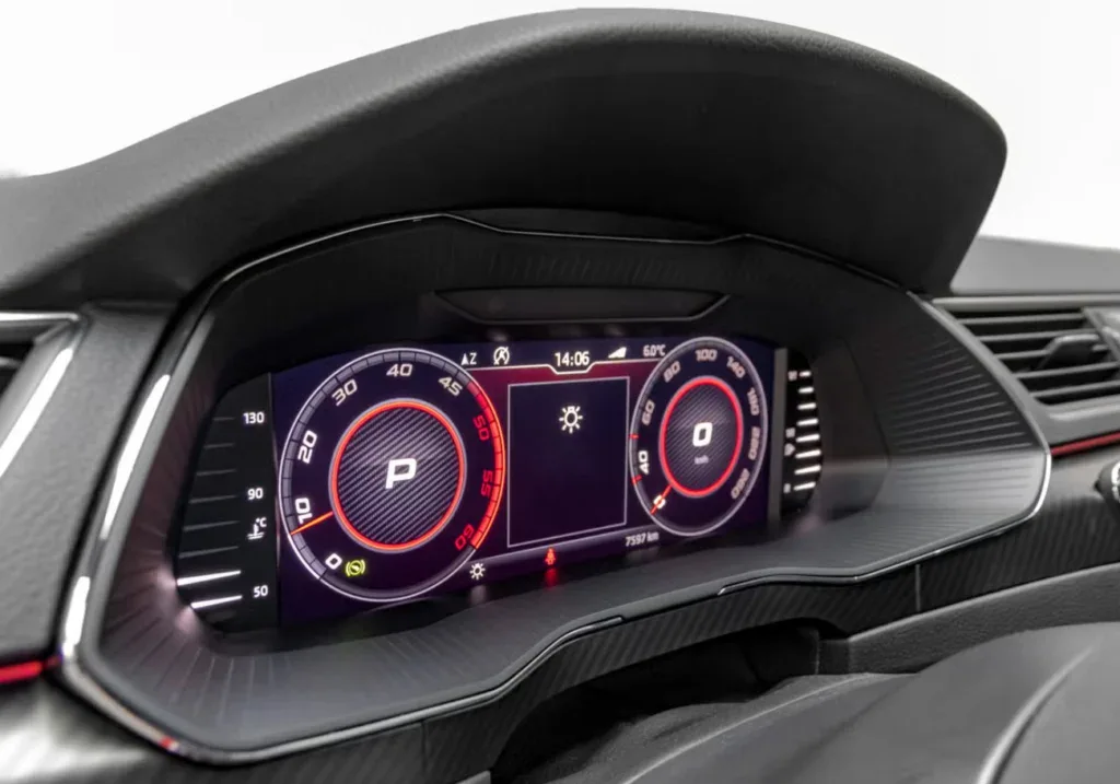 A car’s digital dashboard during Littleton auto repair, showing the gear in park, a speed of zero, a time of 14:06, and an outside temperature of 6.0 degrees Celsius.