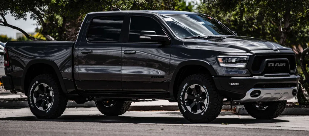 Dark grey Ram pickup truck parked in a Rexburg lot, ready for farm country maintenance.