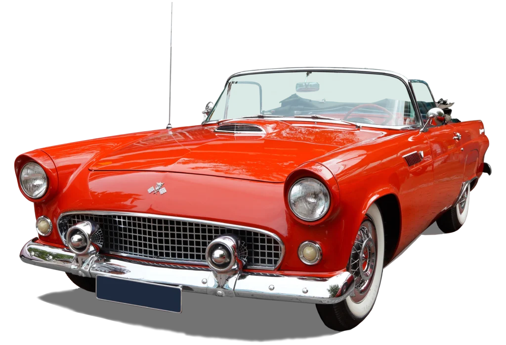 A red vintage Ford Thunderbird convertible with whitewall tires parked on Yellowstone Avenue in Pocatello, Idaho.